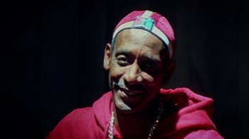 Movie still from “Bamboozled” (2000), directed by Spike Lee – A person wearing a hat; Close Up shot, Low angle