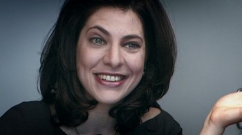 Movie still from “Bamboozled” (2000), directed by Spike Lee – A person with a smile on their face; Close Up shot, High angle