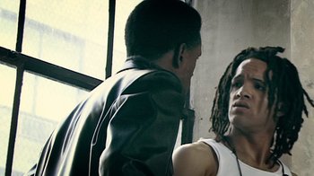 Movie still from “Bamboozled” (2000), directed by Spike Lee – A man and a woman talking to each other; Close Up shot, Over the shoulder angle