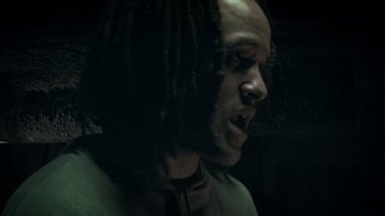 Movie still from “Bamboozled” (2000), directed by Spike Lee – A person with dreadlocks; Close Up shot, Low angle