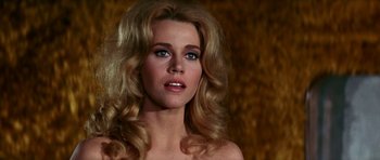 Movie still from “Barbarella” (1968), directed by Roger Vadim – A beautiful woman with long blonde hair and blue eyes; Close Up shot, Low angle