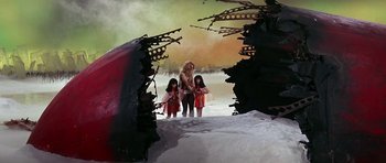 Movie still from “Barbarella” (1968), directed by Roger Vadim – A woman and two children standing in the snow; Wide shot, Low angle