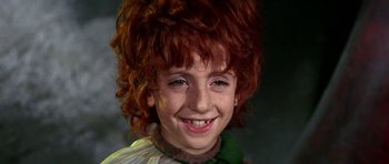 Movie still from “Barbarella” (1968), directed by Roger Vadim – A young girl's face with red hair; Close Up shot, High angle