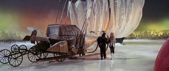 Movie still from “Barbarella” (1968), directed by Roger Vadim – Two people walking next to a boat on a stage; Wide shot, High angle