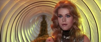 Movie still from “Barbarella” (1968), directed by Roger Vadim – A person with long blonde hair; Close Up shot, Over the shoulder angle