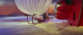 Movie still from “Barbarella” (1968), directed by Roger Vadim – An airplane with a balloon attached to it's wing; Extreme Wide shot, High angle
