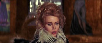 Movie still from “Barbarella” (1968), directed by Roger Vadim – A person wearing a jacket; Close Up shot, Over the shoulder angle