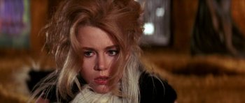 Movie still from “Barbarella” (1968), directed by Roger Vadim – A person wearing a white scarf; Close Up shot, High angle
