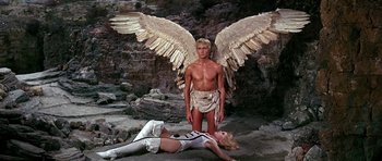 Movie still from “Barbarella” (1968), directed by Roger Vadim – A man and a woman are standing next to each other; Wide shot, High angle