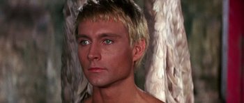 Movie still from “Barbarella” (1968), directed by Roger Vadim – A person wearing a shirt; Close Up shot, Over the shoulder angle