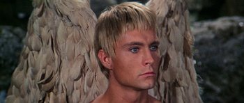 Movie still from “Barbarella” (1968), directed by Roger Vadim – A person wearing a costume with wings; Close Up shot, High angle