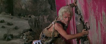 Movie still from “Barbarella” (1968), directed by Roger Vadim – A man with a bunch of wires attached to his body; Medium shot, Low angle