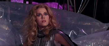 Movie still from “Barbarella” (1968), directed by Roger Vadim – A person with long blonde hair; Close Up shot, Low angle