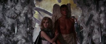 Movie still from “Barbarella” (1968), directed by Roger Vadim – A man and a woman are dressed as angels; Medium shot, Low angle