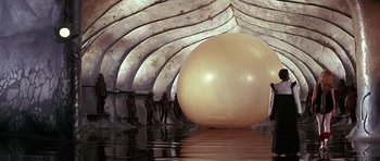 Movie still from “Barbarella” (1968), directed by Roger Vadim – An inflatable ball in the middle of a body of water; Extreme Wide shot, Low angle