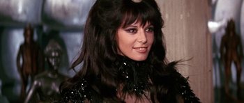 Movie still from “Barbarella” (1968), directed by Roger Vadim – A person with long black hair; Close Up shot, Over the shoulder angle