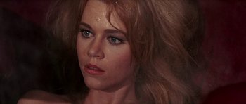 Movie still from “Barbarella” (1968), directed by Roger Vadim – A woman's face with a lot of hair; Close Up shot, High angle