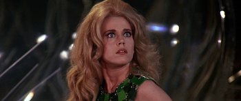 Movie still from “Barbarella” (1968), directed by Roger Vadim – A person with long blonde hair; Close Up shot, Low angle