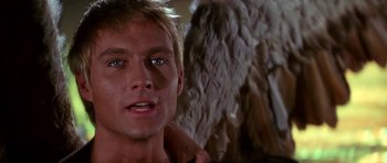 Movie still from “Barbarella” (1968), directed by Roger Vadim – A man's face in front of an angel; Close Up shot, Low angle