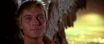 Movie still from “Barbarella” (1968), directed by Roger Vadim – A man's face with a tree in the background; Close Up shot, Low angle