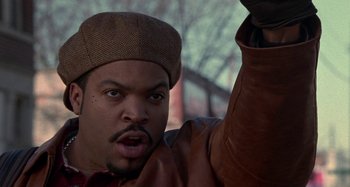 Movie still from “Barbershop” (2002), directed by Tim Story – A person wearing a hat; Close Up shot, Low angle