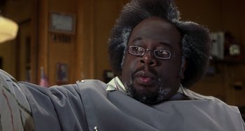 Movie still from “Barbershop” (2002), directed by Tim Story – A person with a beard; Close Up shot, Low angle