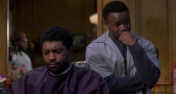Movie still from “Barbershop” (2002), directed by Tim Story – Two men sitting in front of each other in a room; Close Up shot, Over the shoulder angle