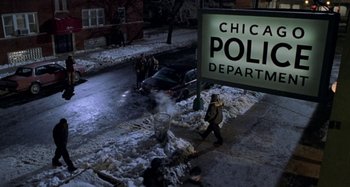 Movie still from “Barbershop” (2002), directed by Tim Story – A group of people walking down a street; Extreme Wide shot, High angle