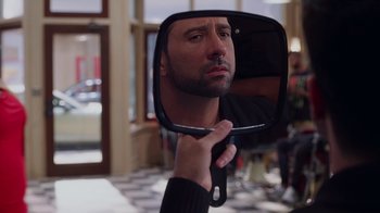 Movie still from “Barbershop: The Next Cut” (2016), directed by Malcolm D. Lee – A man looking at himself in a mirror; Close Up shot, Over the shoulder angle