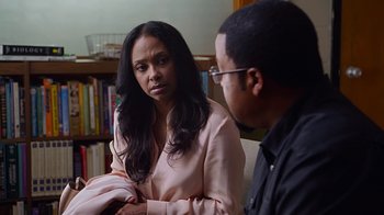 Movie still from “Barbershop: The Next Cut” (2016), directed by Malcolm D. Lee – A woman sitting next to a man on a couch; Close Up shot, Over the shoulder angle