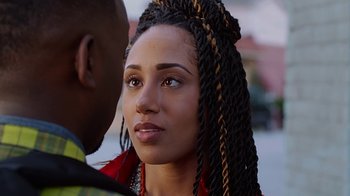 Movie still from “Barbershop: The Next Cut” (2016), directed by Malcolm D. Lee – A person with a braid; Close Up shot, Over the shoulder angle
