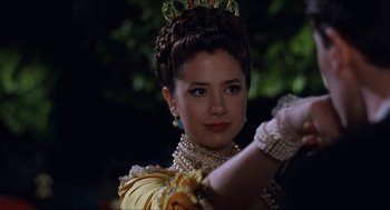 Movie still from “Barcelona” (1994), directed by Whit Stillman – A woman in a yellow dress and a tiara; Close Up shot, Over the shoulder angle