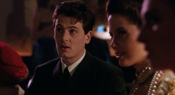 Movie still from “Barcelona” (1994), directed by Whit Stillman – A man and a woman are looking at the camera; Close Up shot, Over the shoulder angle