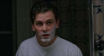 Movie still from “Barcelona” (1994), directed by Whit Stillman – A man with shaving cream all over his face; Close Up shot, Over the shoulder angle
