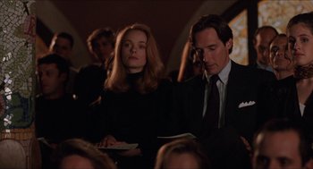 Movie still from “Barcelona” (1994), directed by Whit Stillman – A man and a woman are sitting together in a room; Medium shot, Low angle