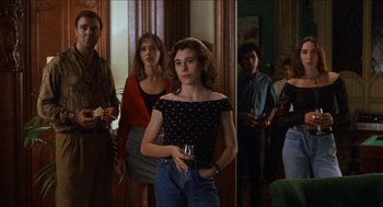 Movie still from “Barcelona” (1994), directed by Whit Stillman – A group of people standing in a room with wine glasses; Medium shot, Over the shoulder angle