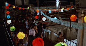 Movie still from “Barcelona” (1994), directed by Whit Stillman – A group of people standing on top of a building; Wide shot, High angle