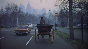 Movie still from “Barefoot in the Park” (1967), directed by Gene Saks – A horse drawn carriage traveling down a street; Wide shot, High angle