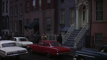 Movie still from “Barefoot in the Park” (1967), directed by Gene Saks – A red car parked on the side of the street; Extreme Wide shot, High angle