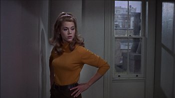 Movie still from “Barefoot in the Park” (1967), directed by Gene Saks – A woman standing in front of a window in a room; Medium shot, Low angle