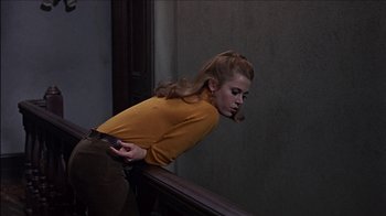 Movie still from “Barefoot in the Park” (1967), directed by Gene Saks – A woman leaning on a railing while holding a cell phone; Medium shot, High angle