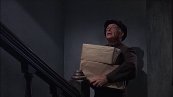 Movie still from “Barefoot in the Park” (1967), directed by Gene Saks – An old man holding a box in his hands; Medium shot, Low angle
