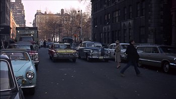 Movie still from “Barefoot in the Park” (1967), directed by Gene Saks – A group of cars parked on the side of the street; Extreme Wide shot, High angle