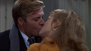 Movie still from “Barefoot in the Park” (1967), directed by Gene Saks – A man and a woman kissing each other in front of a window; Close Up shot, Over the shoulder angle