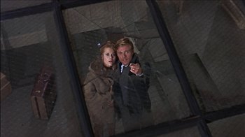 Movie still from “Barefoot in the Park” (1967), directed by Gene Saks – A man and a woman standing next to each other in front of a window; Medium shot, Low angle