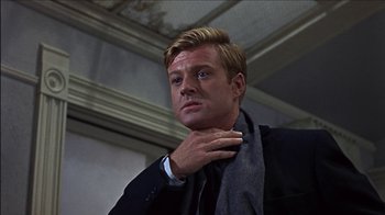 Movie still from “Barefoot in the Park” (1967), directed by Gene Saks – A man in a black suit and a gray scarf; Close Up shot, Low angle