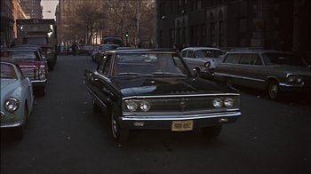 Movie still from “Barefoot in the Park” (1967), directed by Gene Saks – An old car is parked on the side of the road; Wide shot, Over the shoulder angle