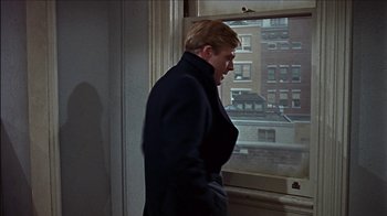 Movie still from “Barefoot in the Park” (1967), directed by Gene Saks – A man standing in front of a large window; Medium shot, Over the shoulder angle