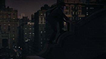 Movie still from “Barefoot in the Park” (1967), directed by Gene Saks – A man riding a skateboard down the side of a building; Wide shot, Low angle