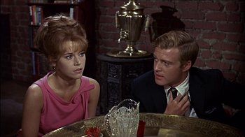 Movie still from “Barefoot in the Park” (1967), directed by Gene Saks – A man and a woman sitting in front of a table; Medium shot, Over the shoulder angle